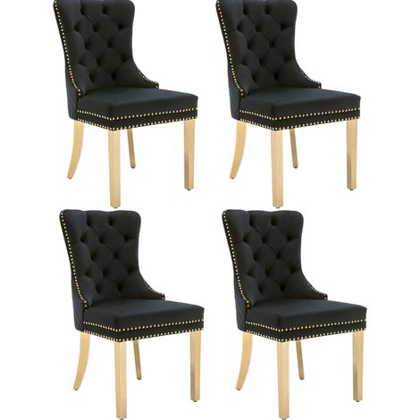 Set de 4 sillas de comedor tapizadas en terciopelo negro con patas doradas (1/5)