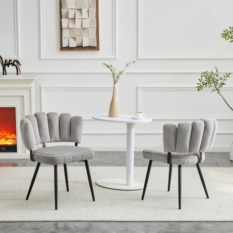 2 Fauteuils de salle à manger design scandinave, dossier ajouré floral, assise en velours gris clair texturé, piétement en acier noir, hauteur 80 cm, idéal pour séjour ou espace repas