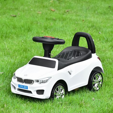 Voiture électrique pour enfant, véhicule à pousser avec coffre à jouets, klaxon, phares et musique, 63,5 x 28 x 36 cm, blanche (1/5)