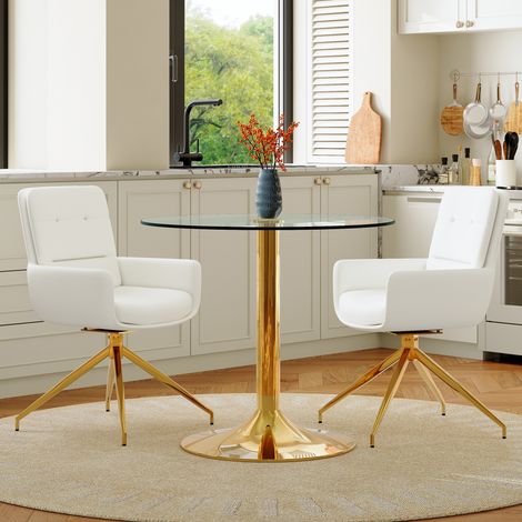 Table ronde en verre trempé 85 cm avec piètement métallique, assortie à 2 chaises pivotantes PU blanc et or, collection luxueuse.
