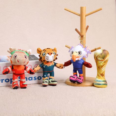 2026 FIFA World Cup mascot, USA, Canada, and Mexico plush toy, and the World Cup trophy.