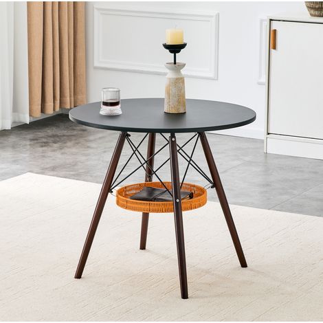 Mesa de comedor redonda Ø80 cm, negra y efecto nogal, MDF, patas de madera maciza y cesta de almacenaje (1/5)