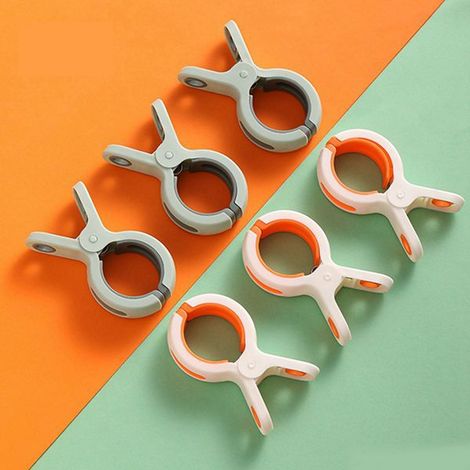 1 set. Colors: green, pink, white. Material: large plastic beach towel clip, wind-resistant. (1/5)
