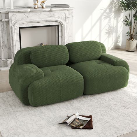 Canapé d’angle modulare in velluto a coste verde, senza struttura, con braccioli curvi e base antiscivolo (1/5)
