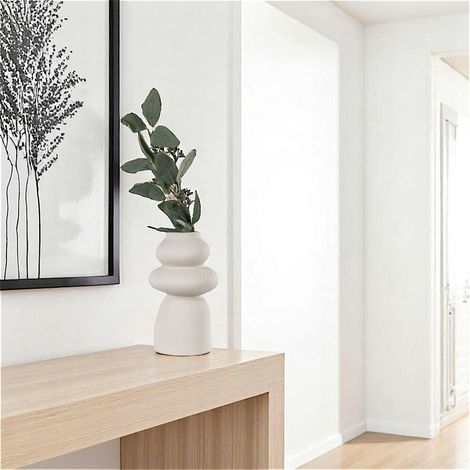 Vase design en céramique beige (1/5)