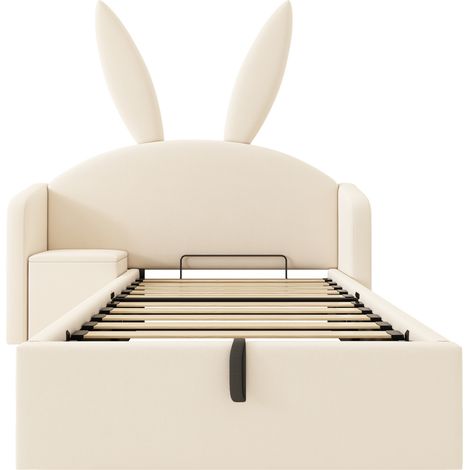 Cama infantil tapizada 90x190 cm beige con cabecero conejo, almacenaje hidráulico y mesita (1/5)