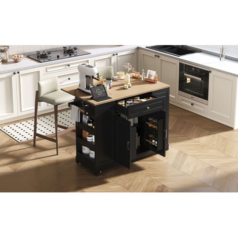 Îlot de cuisine avec roulettes. Espaçage pour les plats supplémentaire. Îlot de cuisine doté de tiroirs multifonctionnels et d’espaces pour le rangement des déchets. (1/5)