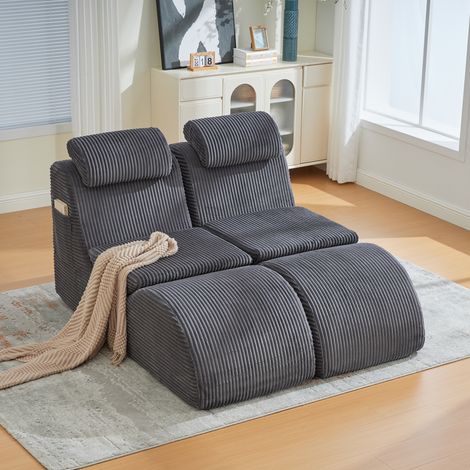 Fauteuil de détente moderne au design unique, ergonomique, en mousse de compression hautement élastique. Coussin d’assise amovible et poche latérale pour un confort quotidien. Gris foncé (1/5)