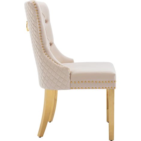 Chaise de salle à manger en velours beige avec pieds en acier inoxydable doré et décor anneau arqué (1/5)