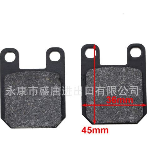 Motorcycle brake pads compatible with 110cc and 125cc off-road vehicles, modified with spring-loaded disc brakes for performance. (1/4)