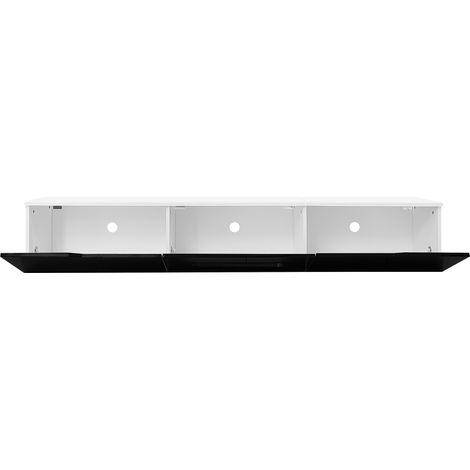 Armoire de télévision en noir et blanc, longue de 180 cm. Sa surface est de couleur mate. Elle est équipée d’un éclairage LED à 16 couleurs. L’armoire peut être installée au mur. (1/5)