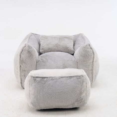 Sillón puff gigante con reposapiés y cojín de pelo sintético gris 123 x 97 x 73 cm HOMVRA (1/5)