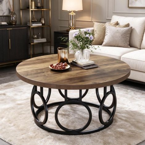 Table basse ronde avec plateau aspect bois vintage et structure en métal noir au design en anneau  idéale pour un intérieur au style moderne ou industriel (table basse uniquement) (1/5)