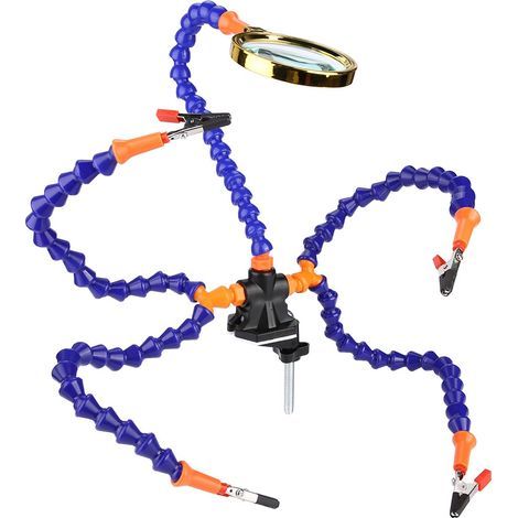 Station de soudage flexible à cinq bras avec pince, loupe et ventilateur.