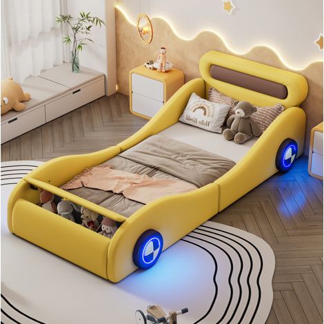 Letto imbottito a forma di auto 90x200 cm per bambini e ragazzi, PU giallo, con ruote luminose e vano contenitore (1/5)