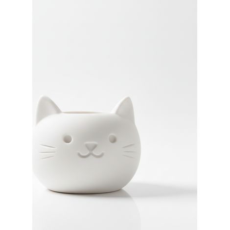 Un vaso decorativo bianco a forma di gatto, perfetto per le piante grasse.