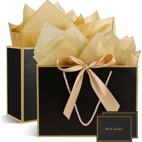 Deux sacs cadeaux en papier avec poignées, deux papiers d'emballage et deux cartes de vœux pour la Saint-Valentin.
