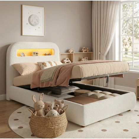 Cama infantil de tejido bouclé blanco, de 90x200 cm, con almacenamiento hidráulico, somier de láminas y luz LED integrada. (1/5)