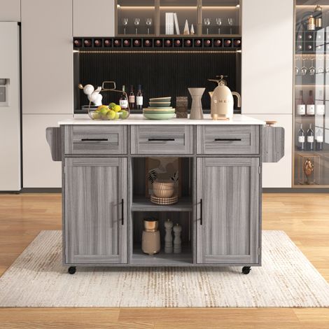 Ce chariot de service / meuble d'appoint présente une structure en placage de bois massif gris et un plan de travail en marbre blanc. Il comprend un plan de travail extensible à abattant et un placard