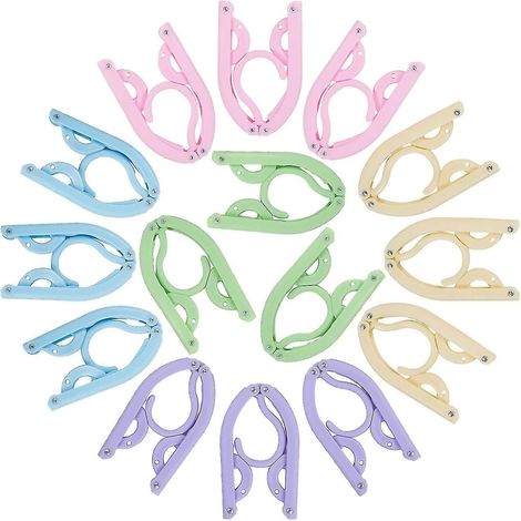 Portant à vêtements portable, pliable et magique, en plastique avec rainure antidérapante, idéal pour la maison et les voyages. (1/5)