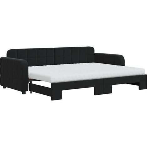 Un canapé-lit avec matelas gigogne, associé à un matelas en velours noir de 80 x 200 cm. (1/5)