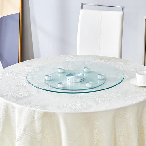 Plateau de table. Plateau rond en verre à deux niveaux, pivotant. Le diamètre du plateau supérieur est de 61 cm, celui du plateau inférieur de 38 cm. Son système pivotant facilite la prise en main et