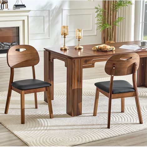 Set de 2 sillas de comedor de madera con respaldo ovalado y asiento acolchado negro (1/5)