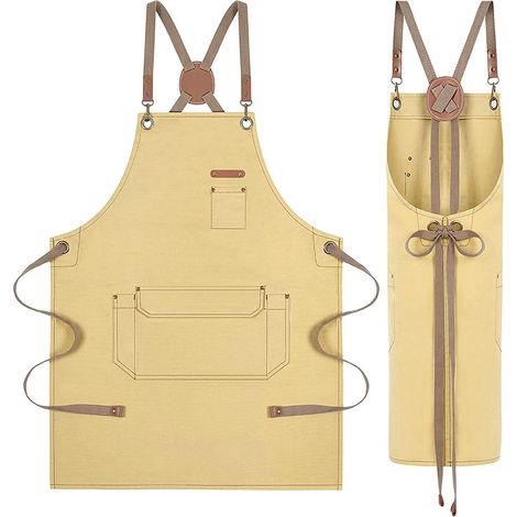 Tablier de coiffure en toile jaune foncé avec détails en cuir et bretelles croisées à l'arrière, plusieurs compartiments de rangement pour le barista du salon et les travaux manuels. (1/2)