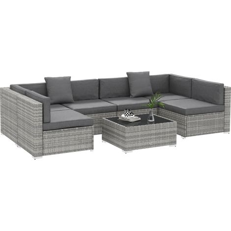 7-teiliges modulares Gartenlounge-Set mit Couchtischplatte aus gehärtetem Glas, inklusive abnehmbarer grauer Kissen.