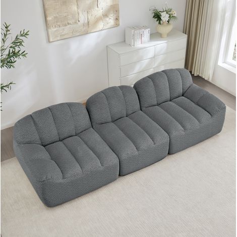 Divano modulare 288/104/79 cm in grigio, senza struttura, con rivestimento morbido e chaise longue (1/5)