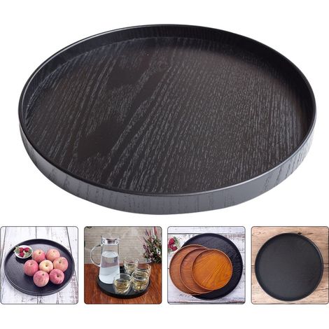 Dos bandejas redondas de madera negra, aptas para almacenar y servir alimentos. (1/5)