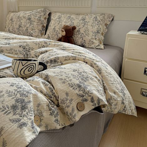Ensemble quatre pièces de draps et housses de couette en lin et coton à boutons, style rétro