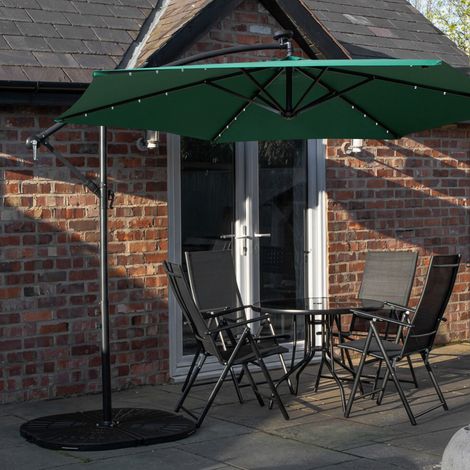 Outdoor 4 Person Round Glass Top Garden Dining Table Chairs With Green Banana Lit Parasol and Base Set (1/5)