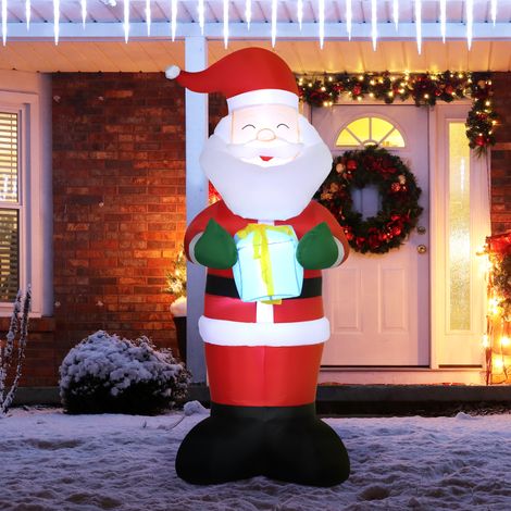 Papá Noel inflable de 180 cm con regalo y luces LED, decoración navideña para interiores y exteriores con inflador incluido. (1/5)