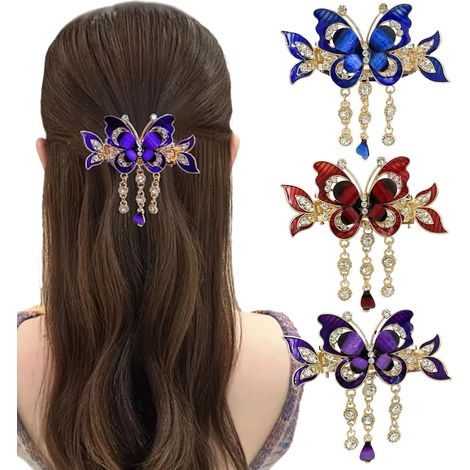 Un set di 3 fermagli per capelli in metallo di medie dimensioni, con nappe a forma di farfalla e strass, adatti a donne e ragazze. (1/3)