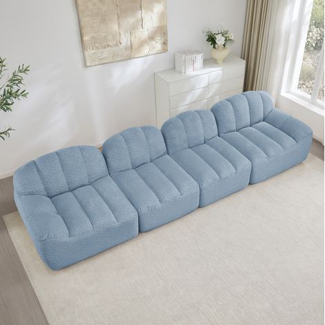 Sofá modular 4 plazas con forma de concha, asiento profundo, tejido polar texturizado azul (1/5)