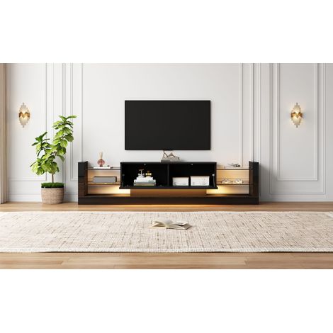 Armoire en verre de haute qualité, équipée d’un éclairage LED. Dimensions : 181 cm. Conçue pour des téléviseurs jusqu’à 80 pouces. La porte est munie de deux compartiments qui peuvent être repliés. (1/5)