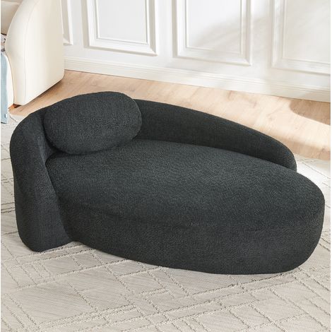 Sofá negro en tejido teddy con diseño redondeado y cojín reposacabezas (1/5)