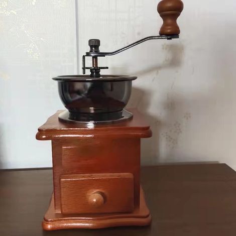 Moulin à café manuel domestique avec tapis antidérapant, pratique et robuste, idéal pour les commerces. (1/5)