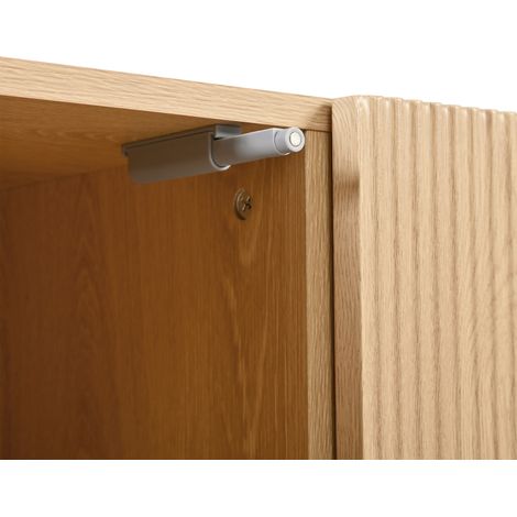 Meuble moderne avec une structure géométrique. Des portes doubles. Des tiroirs au milieu du meuble. De nombreux espaces de rangement.
