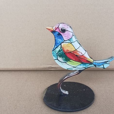 Un objet de décoration original représentant une figurine d'oiseau, un colibri et divers motifs floraux et d'oiseaux. Idéal pour décorer un bureau, une cave à vin ou tout autre élément de décoration i (1/5)