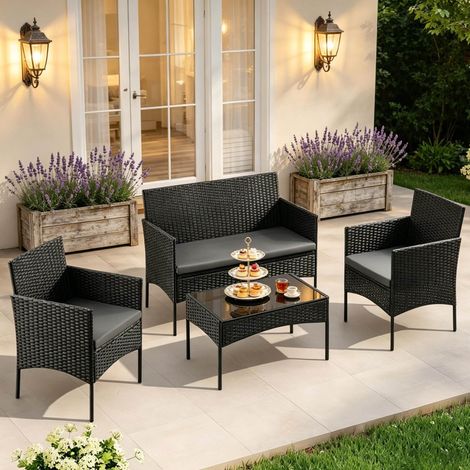 Salón de jardín de 4 plazas en ratán PE, negro con mesa de vidrio DESVIAE (1/5)