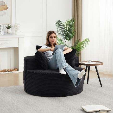 Sillón redondo de 1 plaza en terciopelo de canalé negro, 110 x 110 x 82 cm, con 3 cojines DESVIAE (1/5)