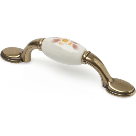 Tirador de Asa para Mueble  Estilo Clásico  Fabricado en Porcelana  Acabado en Blanco Flor  Distancia Entrepuntos: 96 mm  Medidas 1242032 mm  Sistema de Fijación Atornillado  Incluye Tornillos M4  4 U