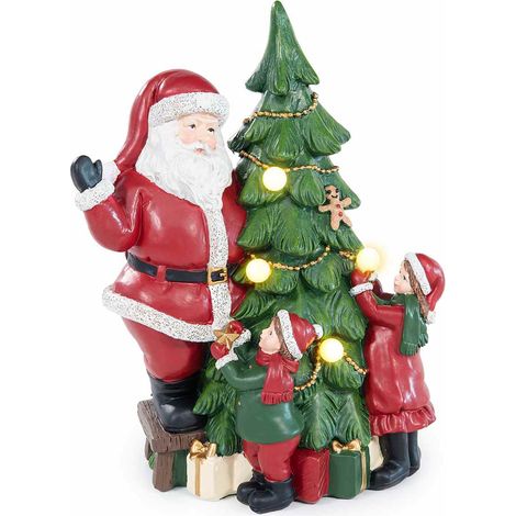 Decorazione natalizia a Babbo Natale con albero, bambini e pacchi dono con luci LED, realizzato in resina colorata, cm 15 x 10,5 x 19,5 H