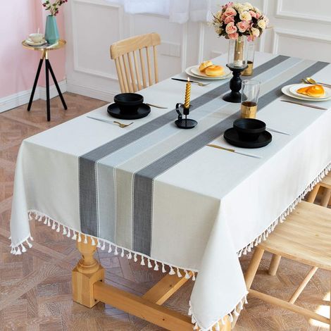 Nappe rectangulaire en coton et lin infroissable, à pompons, grise. (1/5)