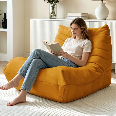 Fauteuil-canapé confortable et moelleux, garni de mousse de haute qualité, idéal pour lire et se détendre. (1/4)