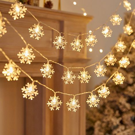 Guirnalda de luces navideñas con 40 LED blancos cálidos que funcionan con pilas (copo de nieve, luz amarilla). (1/5)