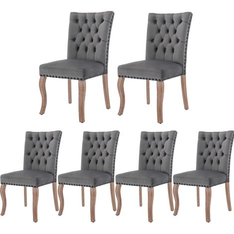 Chaise de salle à manger en velours gris avec pieds en bois massif et détail clique-porte (1/5)