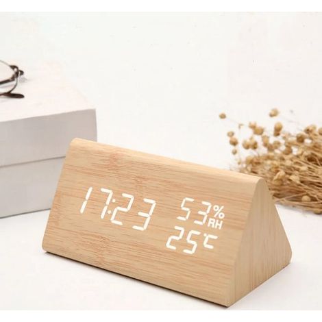 Un despertador de madera con control de sonido, indicador de humedad, temperatura y fecha. (1/4)